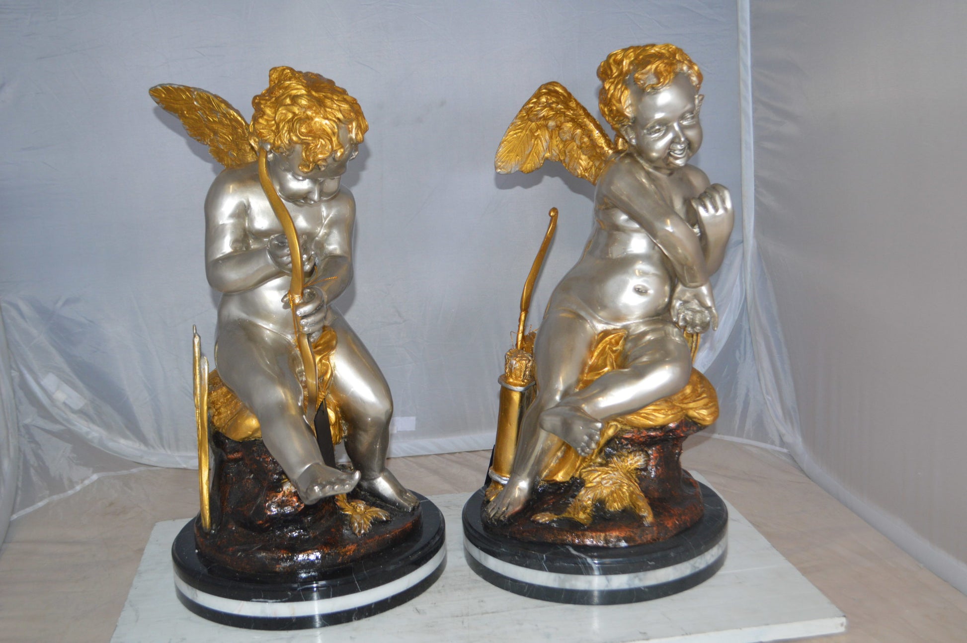 Cupid Girl On A Rock Bronze Statue  -  Size: 20"L x 15"W x 25"H. 