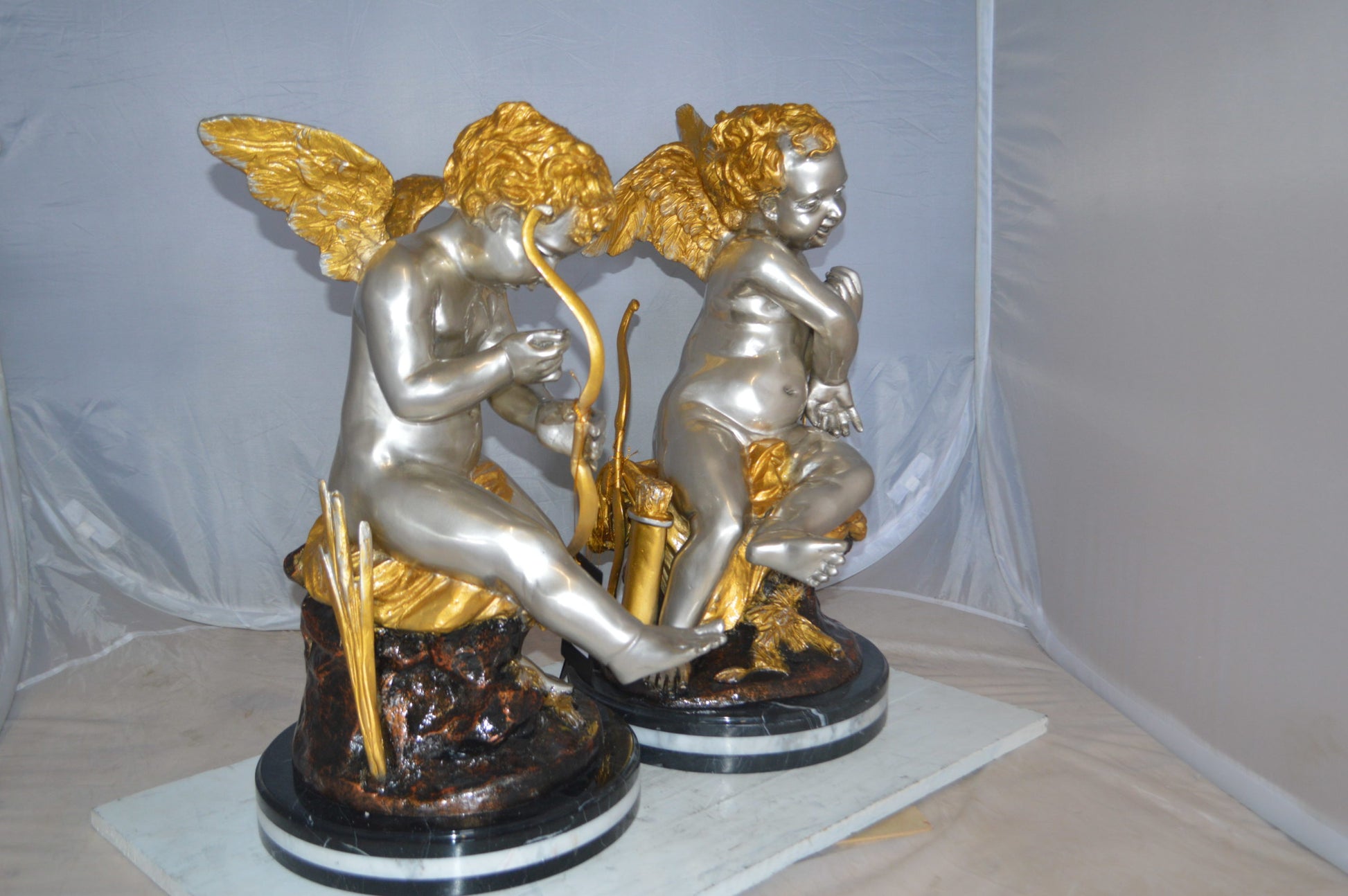 Cupid Girl On A Rock Bronze Statue  -  Size: 20"L x 15"W x 25"H. 