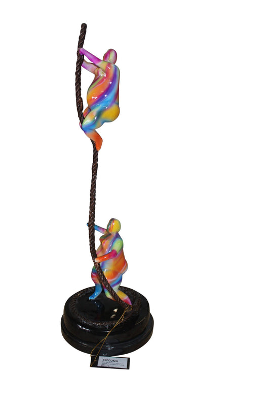 Two fat ladies made of Bronze climbing on rope -  Size: 10"L x 10"W x 31"H. 