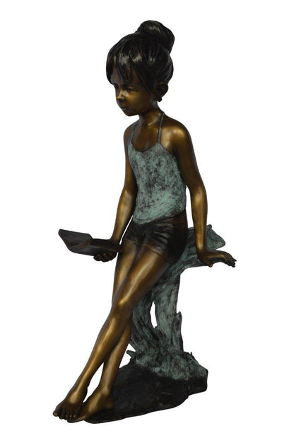 Girl sitting and reading a book bronze statue -  Size: 19"L x 15"W x 36"H.