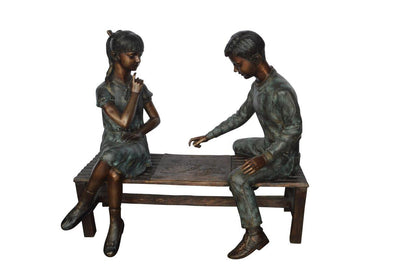 Young Couple Reviewing a World Map Bronze Statue -  Size: 32"L x 47"W x 42"H.