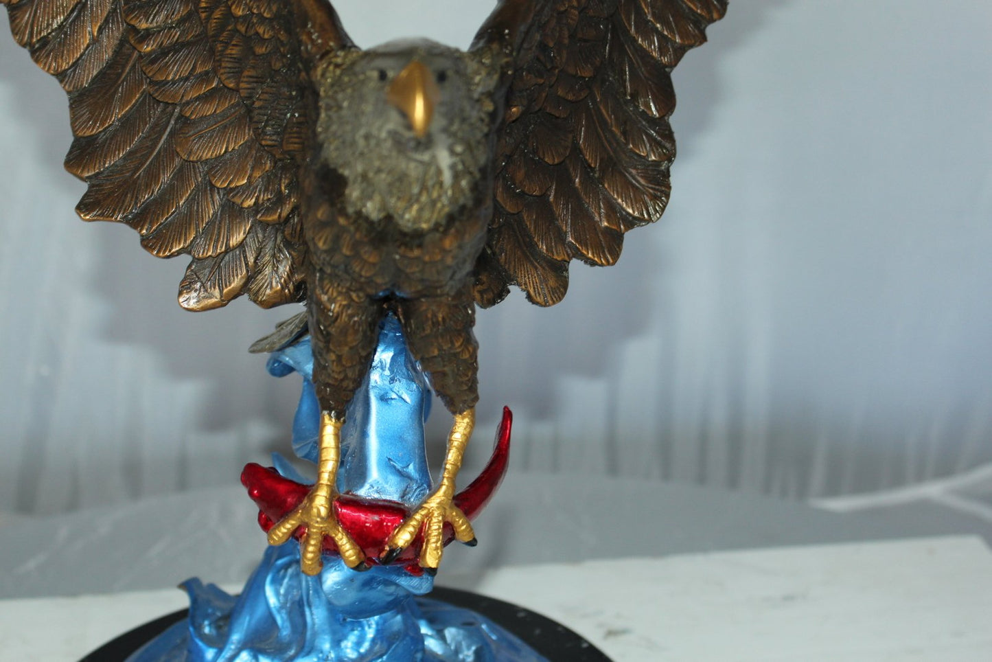 Eagle Catching his Prey Bronze Statue -  Size: 17"L x 20"W x 25"H.