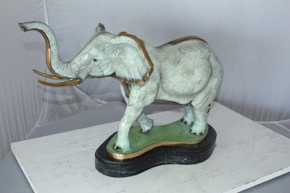 Elephant Medium Bronze Statue -  Size: 26"L x 8"W x 17"H.