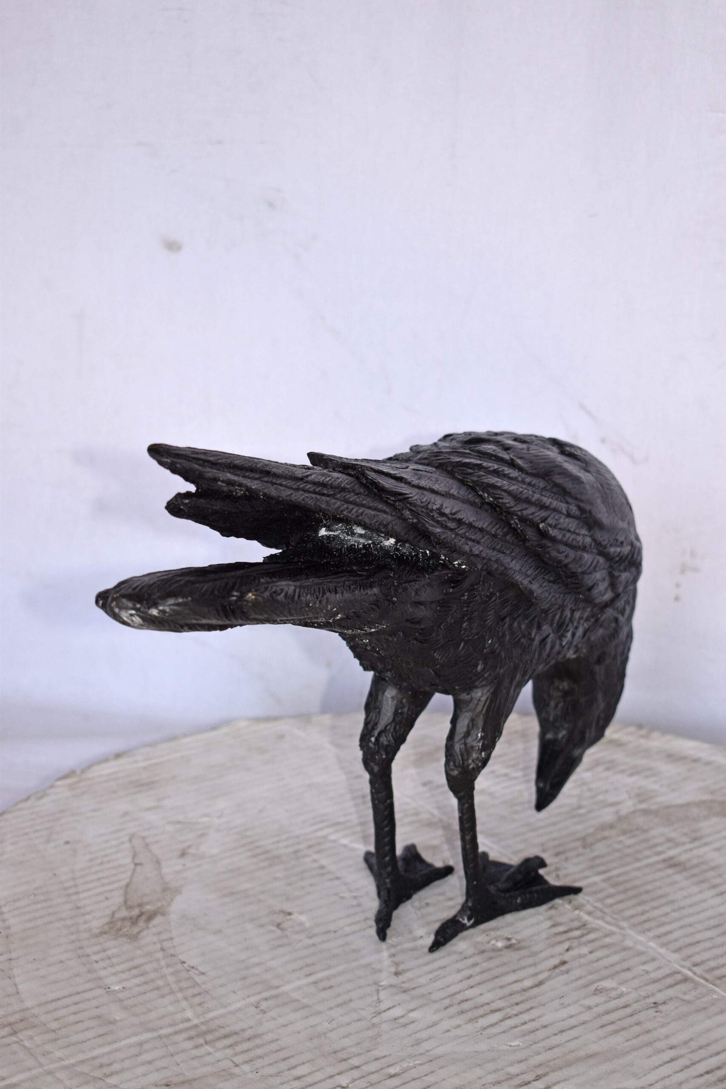Raven Looking Down Bronze State - Size: 19"L x 5"W x 11"H.