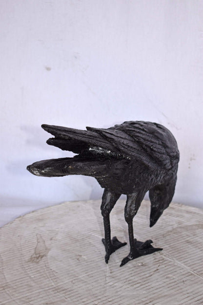 Raven Looking Down Bronze State - Size: 19"L x 5"W x 11"H.