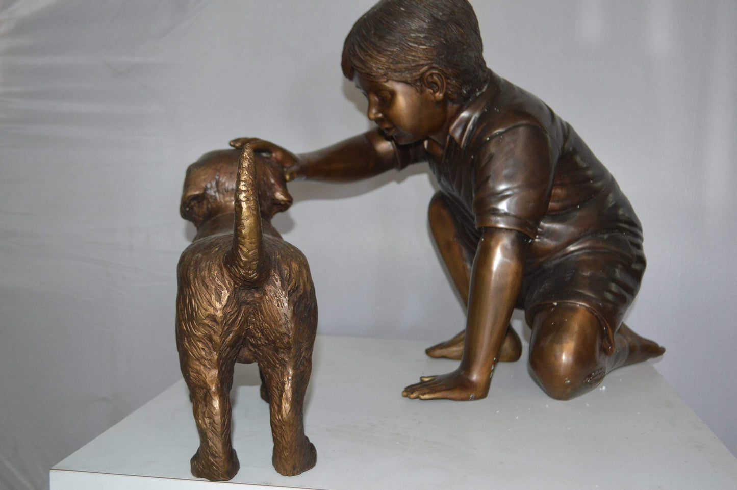 Boy and Dog Bronze Statue - Size: 30"L x 18"W x 18"H.