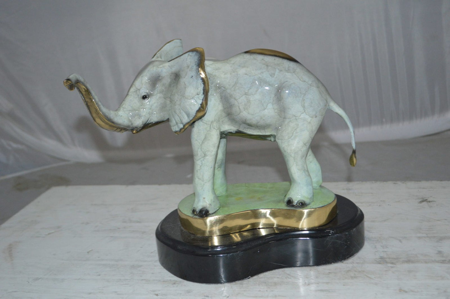 Elephant trunk Up Bronze Statue -  Size: 16"L x 9"W x 10"H.