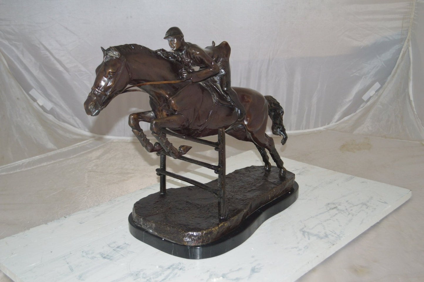 Jockey With Horse Jumping Over Hurdle Bronze Statue Medium  23"L x 10"W x 16"H.