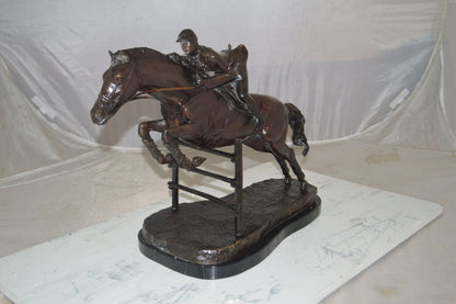 Jockey With Horse Jumping Over Hurdle Bronze Statue Medium  23"L x 10"W x 16"H.