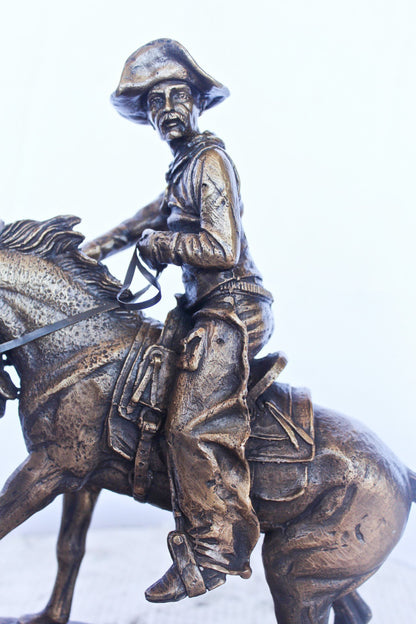 Remington replica Cowboy bronze statue -  Size: 5"L x 15"W x 13"H.