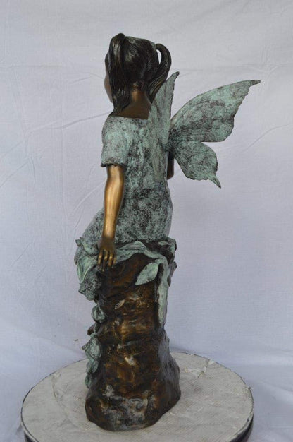 Angel girl sitting with a rose bronze statue -  Size: 22"L x 27"W x 37"H.