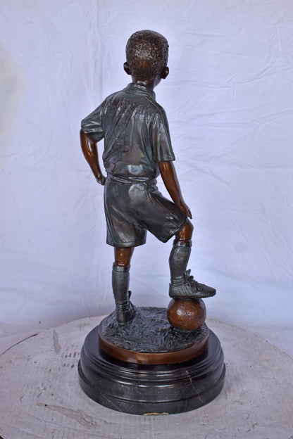 Soccer Boy Player in Action Bronze Statue on Marble - Size: 12"L x 12"W x 26"H.