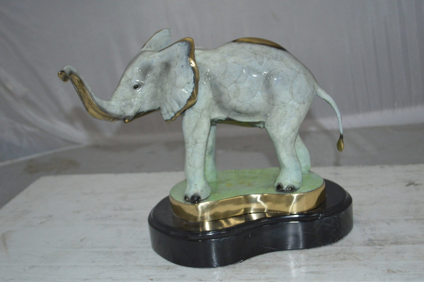 Elephant trunk Up Bronze Statue -  Size: 16"L x 9"W x 10"H.