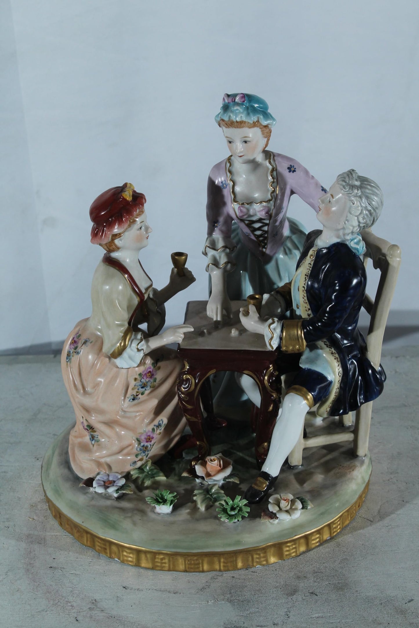 NIFAO Porcelain Figurine Group at Table with Cups 10"x10"x13"H