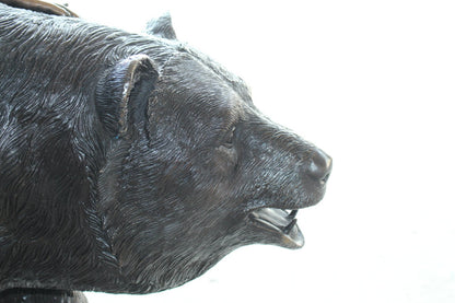A bear with a boy bronze statue -  Size: 39"L x 24"W x 32"H.