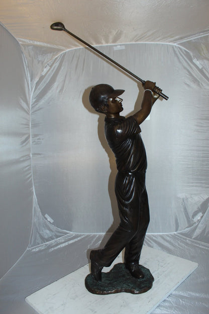 Teen boy plays golf Bronze Statue -  Size: 18"L x 13"W x 57"H.