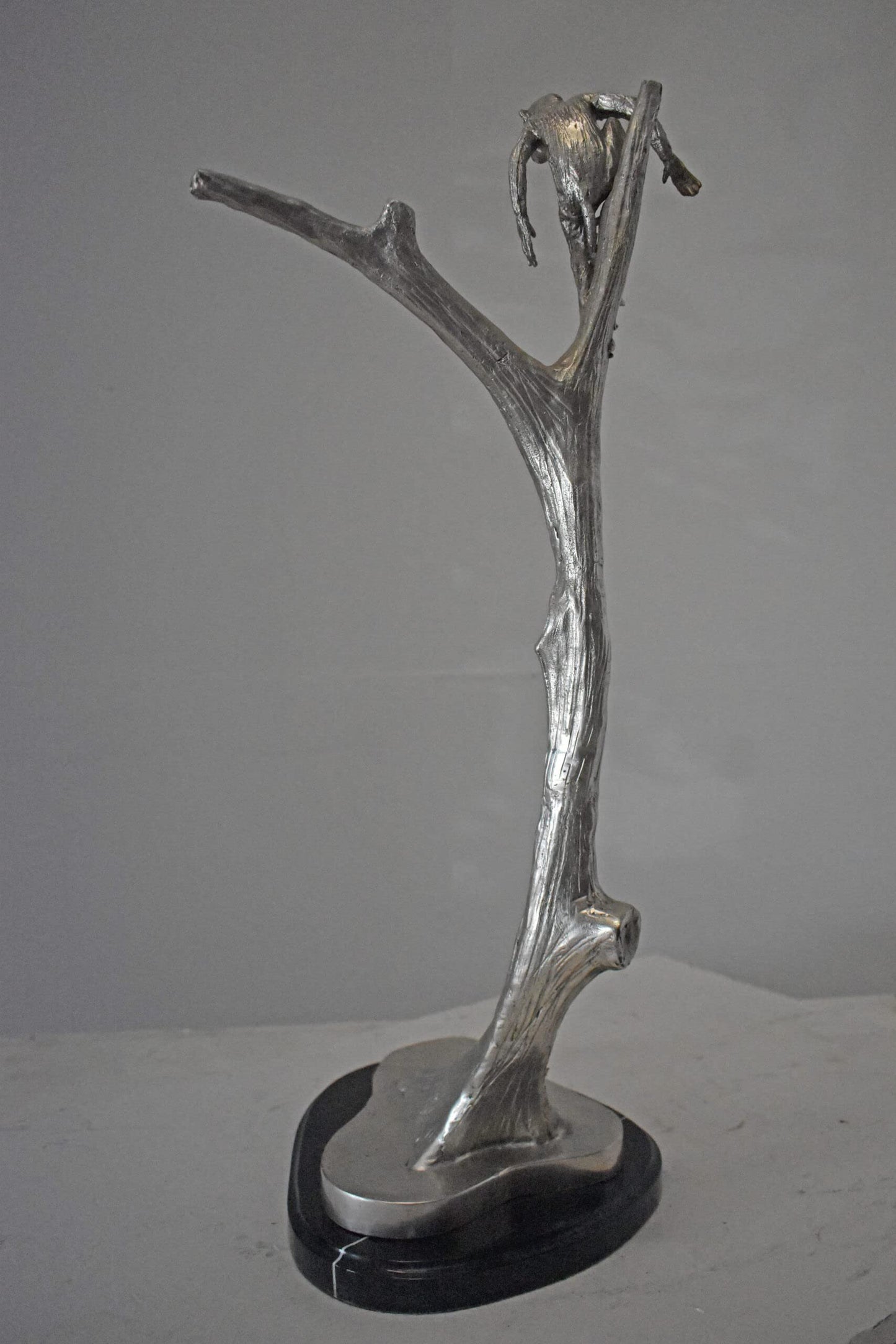 Monkey Resting on a Tree Silver Finish Bronze Statue - Size: 12" x 13" x 27"H.