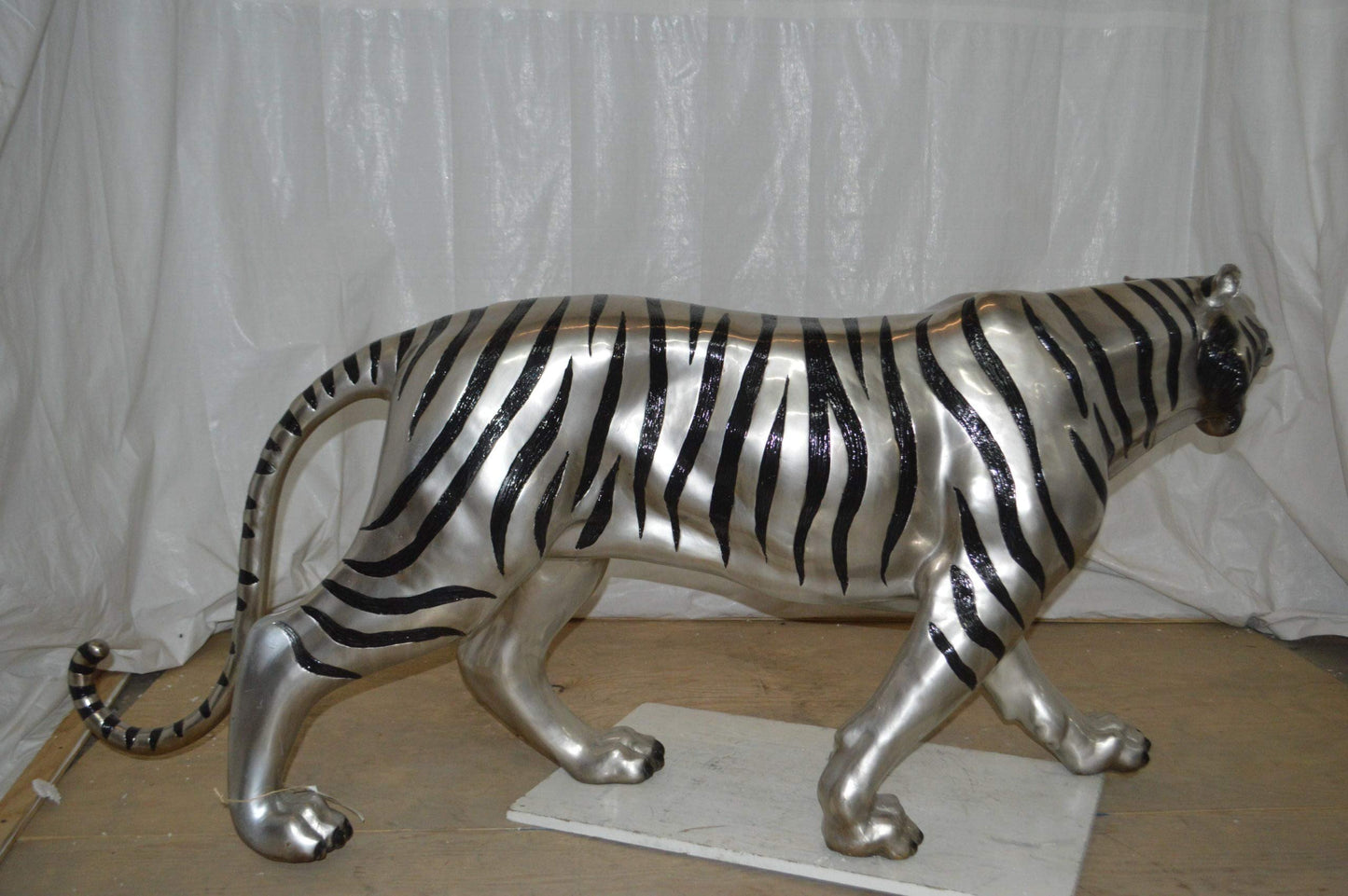 Tiger bronze statue with black and silver finish - Size: 80"L x 15"W x 34"H.