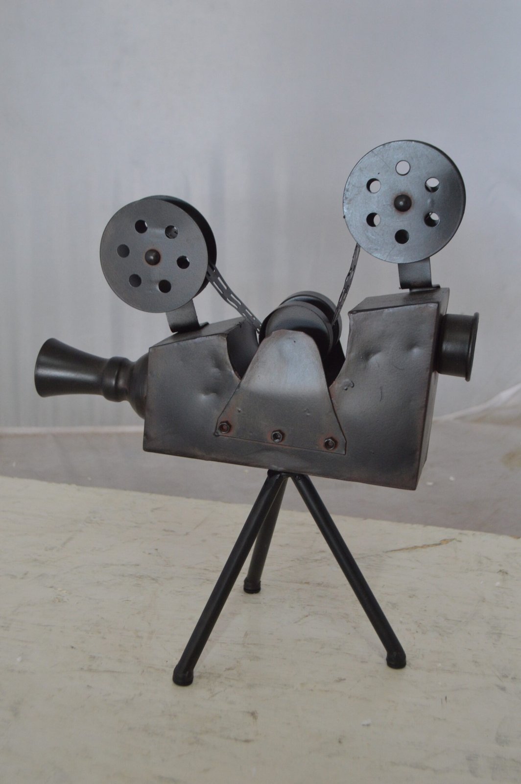 Movie Reel Abstract Metal Statue on tripod -  Size: 12"L x 6"W x 15"H.