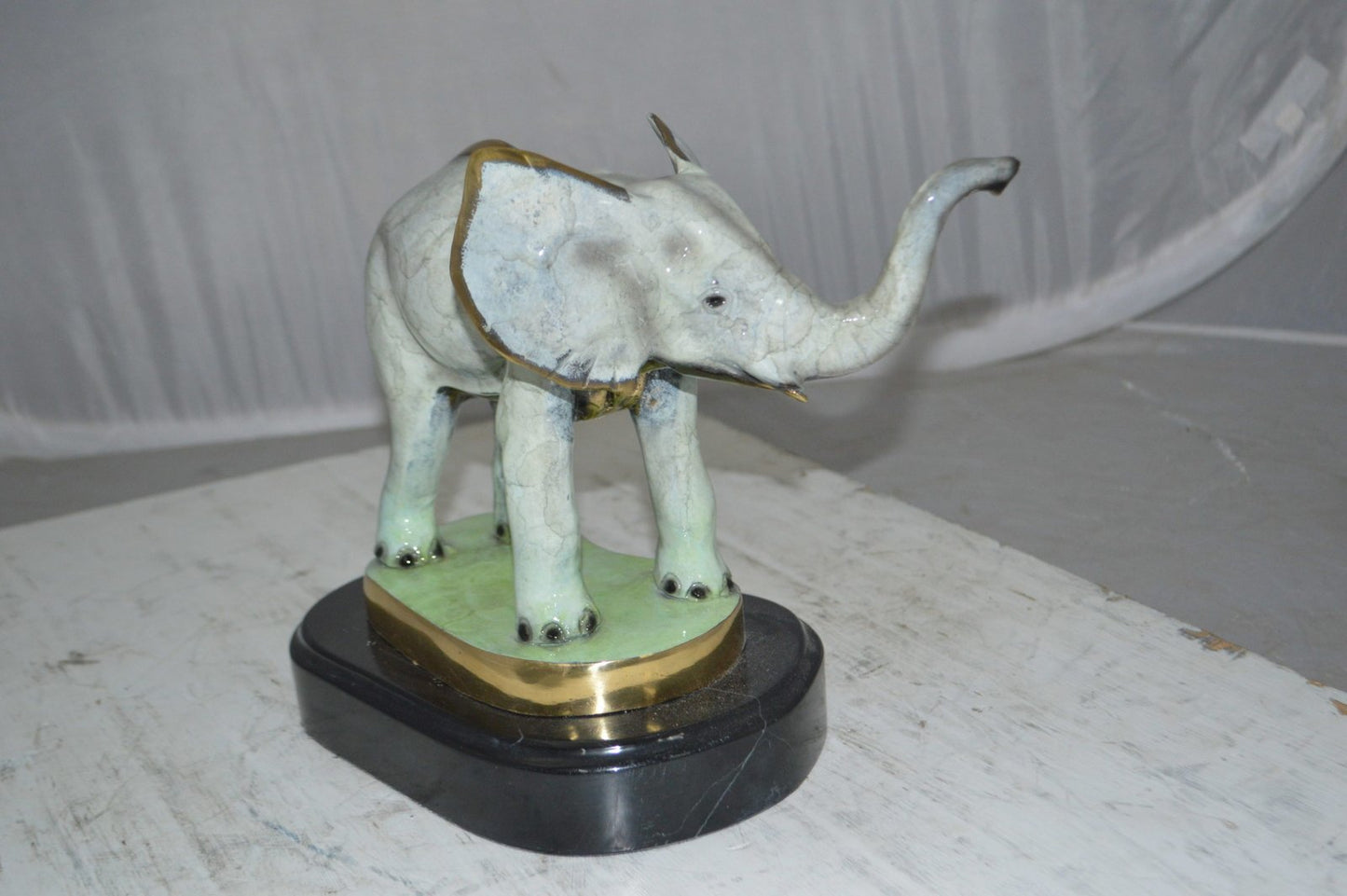 Elephant trunk Up Bronze Statue -  Size: 16"L x 9"W x 10"H.