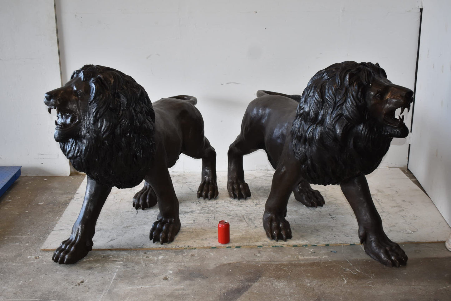A Pair of Large Lions Walking Side by Side Bronze Statues Size: 24" x 60" x 41"H