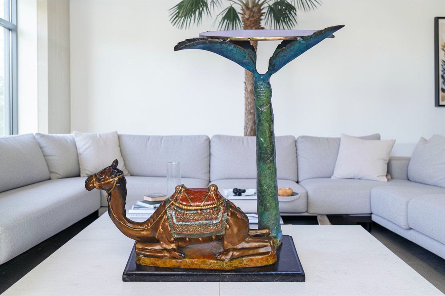 Camel Sitting Under A Palm Tree Bronze Statue - Size: 17"L x 27"W x 23"H.