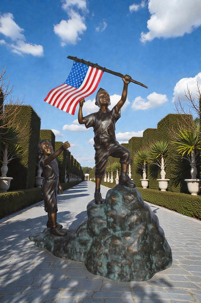 Two Kids on Rock W the American Flag Bronze Statue -  Size: 50"L x 22"W x 58"H.