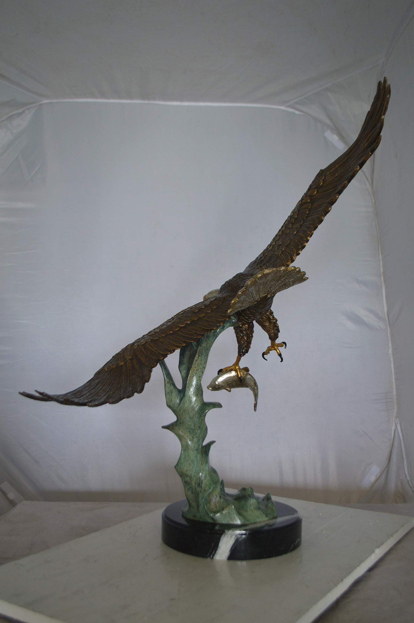 Eagle Flying With His Pray Bronze Statue -  Size: 32"L x 15"W x 33"H.
