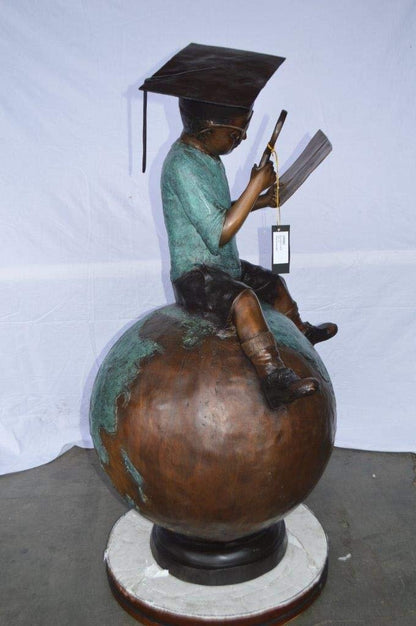 Student learning on top of world bronze statue -  Size: 28"L x 24"W x 52"H.