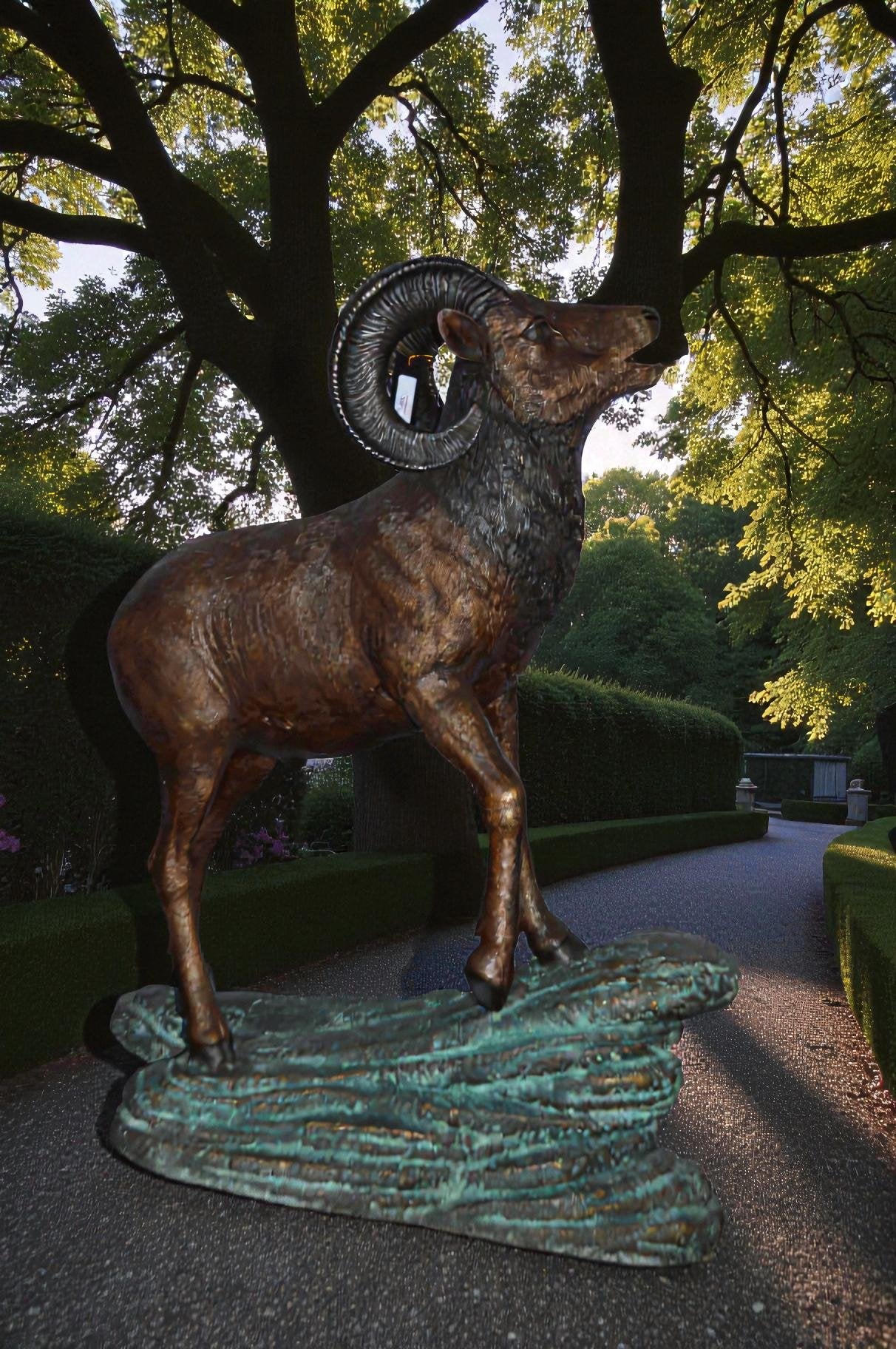 Life Size Ram standing on a rock Bronze Statue - Size: 38"L x 19"W x 45"H.