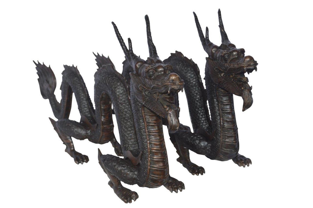 Pair of Dragons sitting side by side bronze statues -  Size: 31"L x 7"W x 16"H.