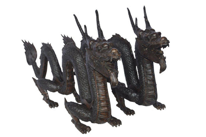 Pair of Dragons sitting side by side bronze statues -  Size: 31"L x 7"W x 16"H.