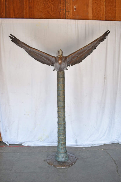 Life Size Pelican Flying Bronze Status - Size: 69"L x 45"W x 88"H.