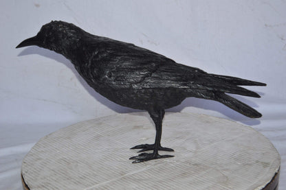 Raven with his head up Bronze Statue - Size: 23"L x 6"W x 13"H.