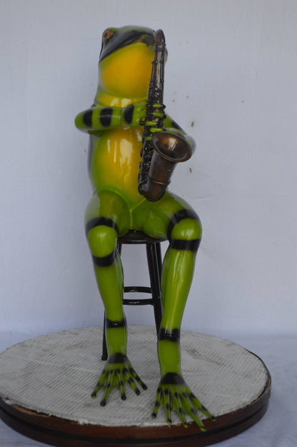 Green frog playing saxophone bronze statue - Size: 23"L x 15"W x 30"H.