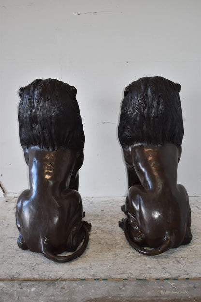 A Pair of Large Lions Sitting Side by Side Bronze Statues Size: 23" x 33" x 46"H