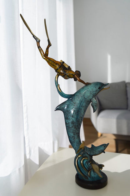 Diver With Dolphin Bronze Statue -  Size: 10"L x 30"W x 49"H.