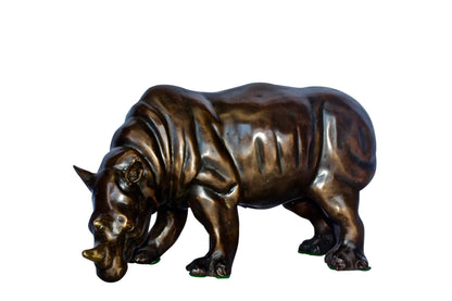 Relaxed Rhino bronze statue -  Size: 16"L x 9"W x 8"H.