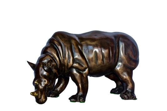 Relaxed Rhino bronze statue -  Size: 16"L x 9"W x 8"H.