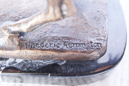 Remington replica Cowboy bronze statue -  Size: 5"L x 15"W x 13"H.