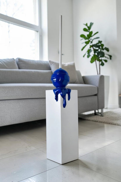 Blue Lollipop Mounted on A White Pedestal Resin Statue Size: 10" x 10" x 59"H