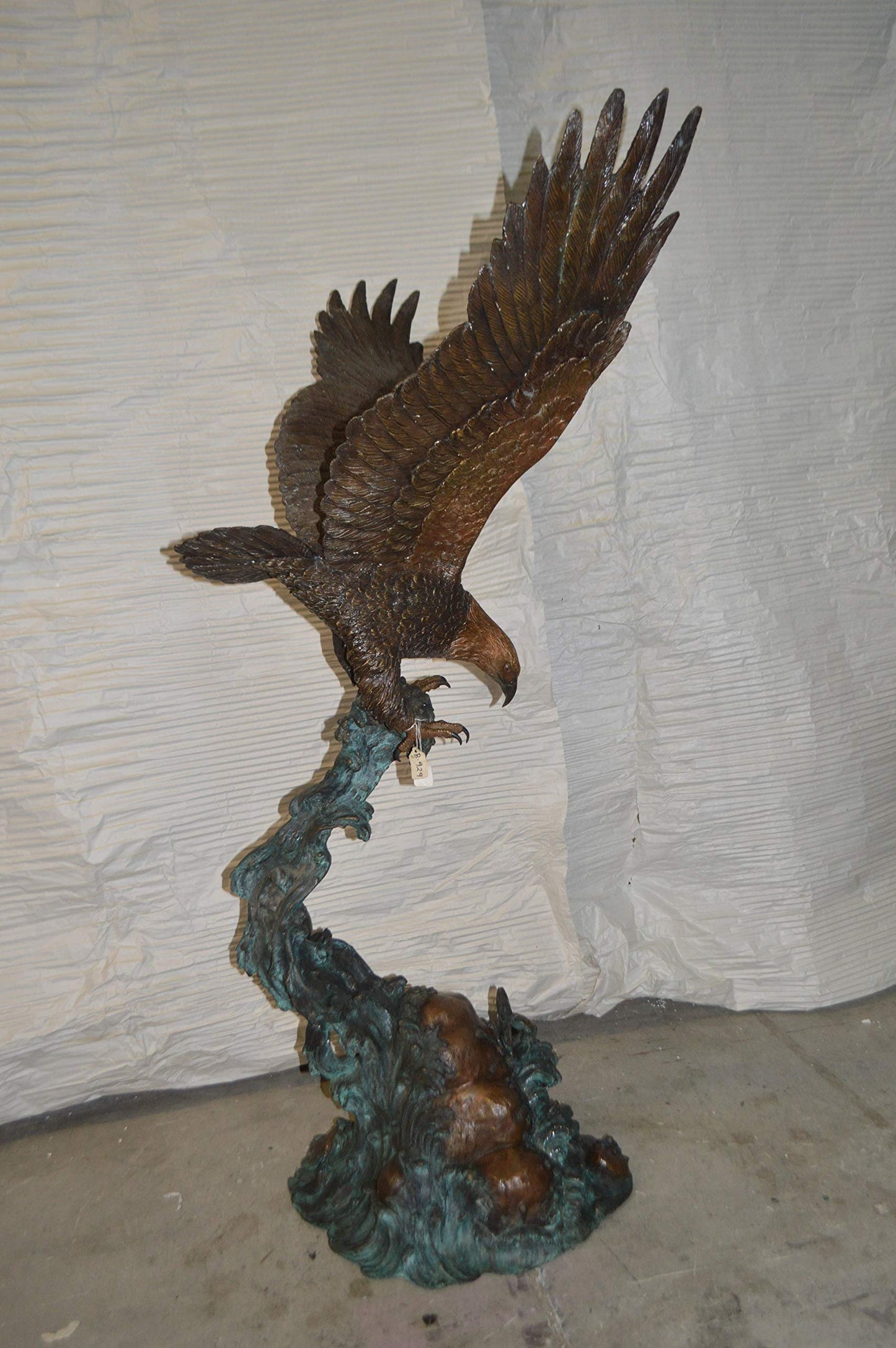 Flying Eagle on Wave Bronze Statue -  Size: 25"L x 35"W x 57"H.