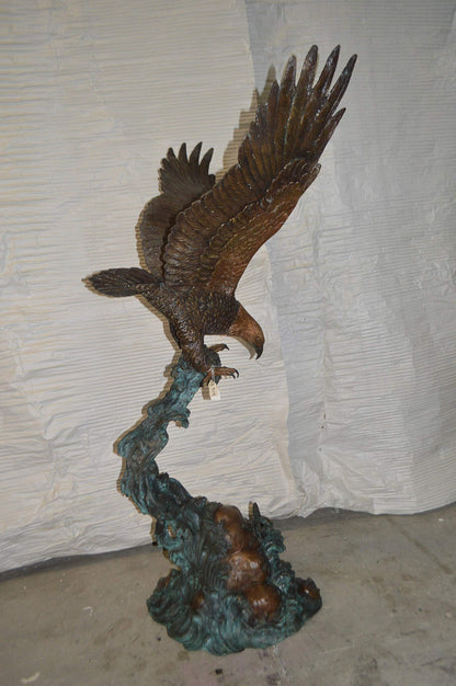 Flying Eagle on Wave Bronze Statue -  Size: 25"L x 35"W x 57"H.