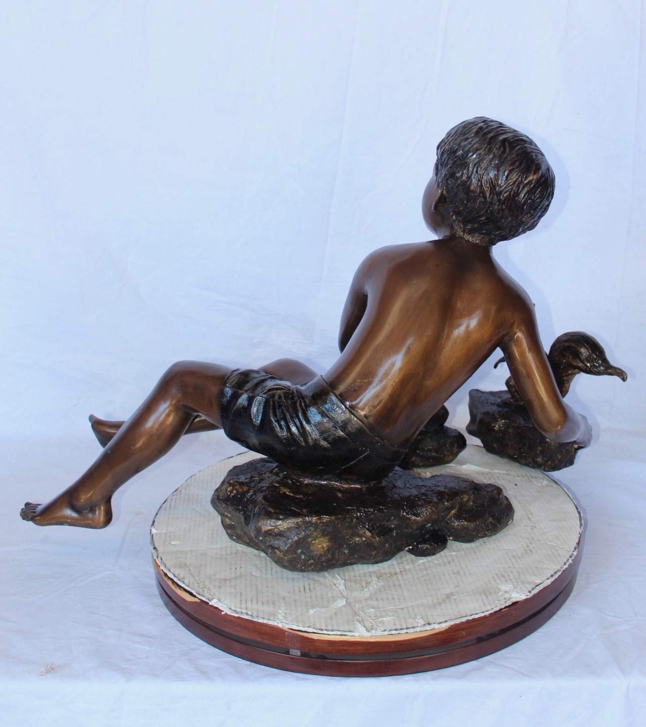 Adventurous boy with squirrel bronze statue -  Size: 36"L x 18"W x 22"H.