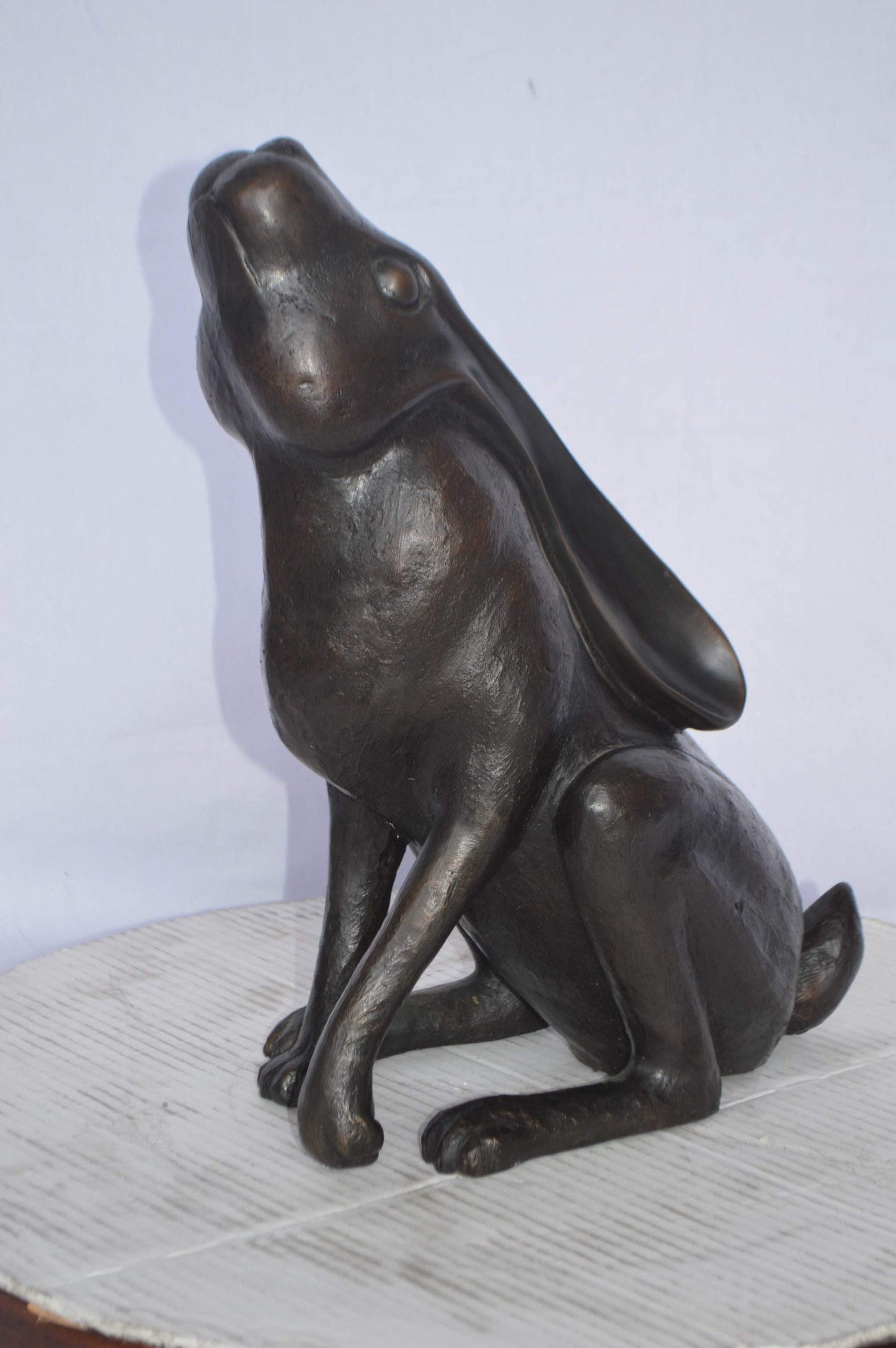 Rabbit Gazing Up Bronze Statue - Size: 8"L x 14"W x 16"H.