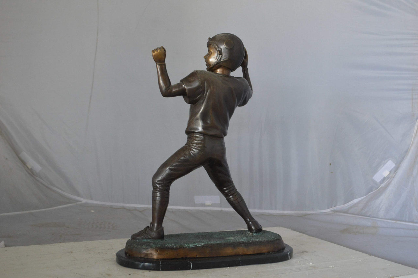 Young Quarterback bronze statue - Size: 14"L x 6"W x 20"H.