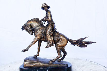 Remington replica Cowboy bronze statue -  Size: 5"L x 15"W x 13"H.
