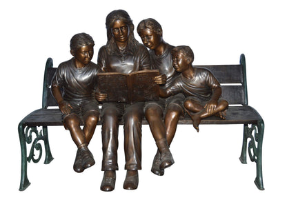 Mom and boys reading stories on bench bronze statue - Size: 53"L x 33"W x 39"H.