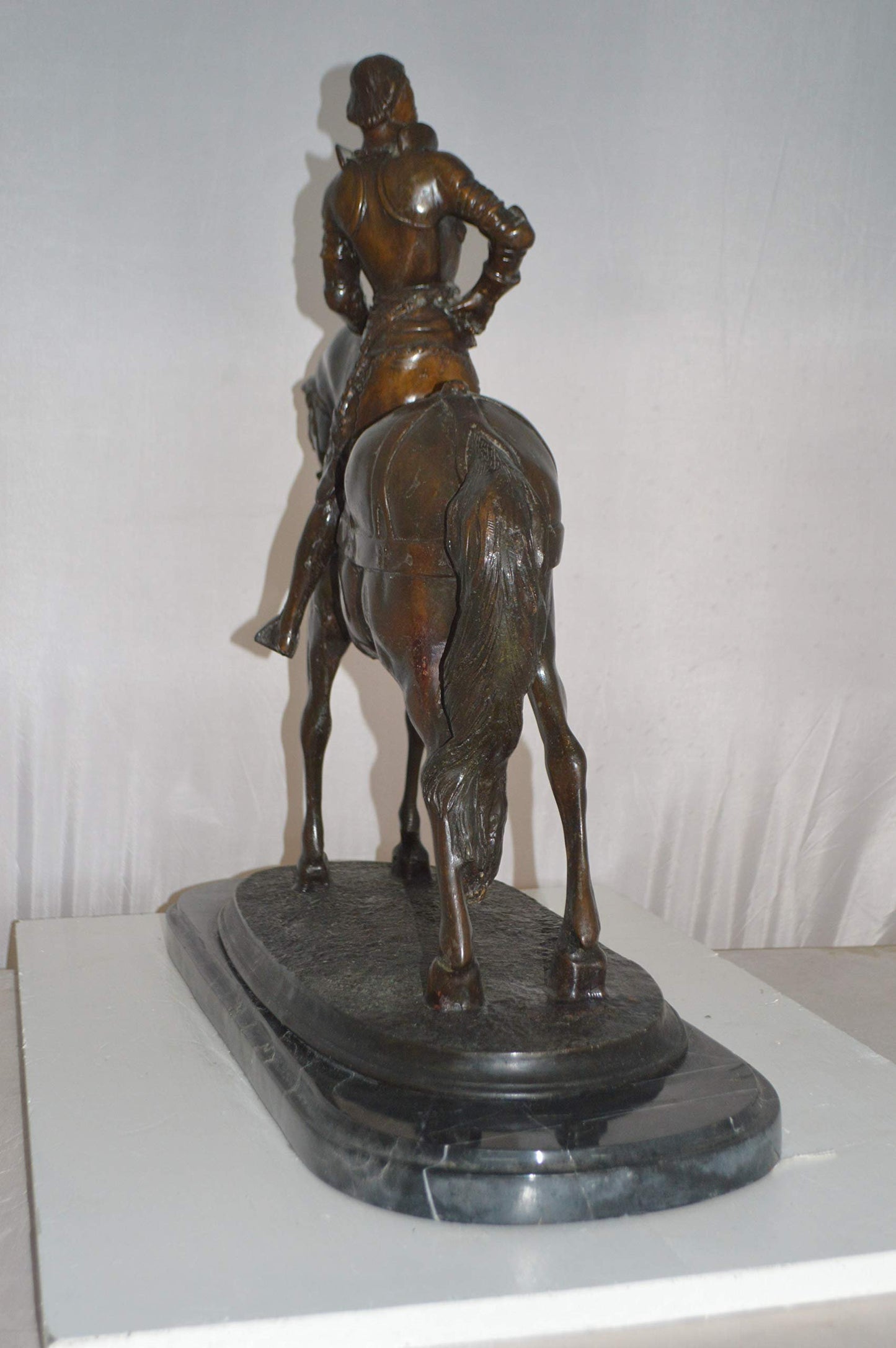 Man on his Horse Bronze Statue -  Size: 30"L x 10"W x 25"H.