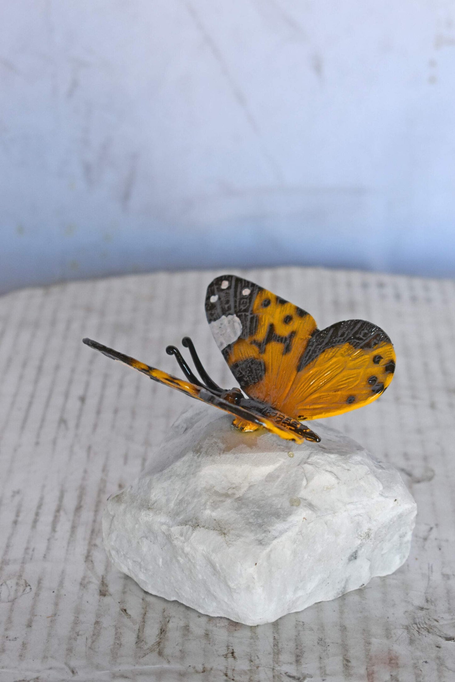 Orange Butterfly made of Bronze mounted on a rock - Size: 5"L x 5"W x 4"H.